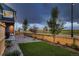 Exterior showcasing lawn and landscaped area at 6309 N Hanover St, Denver, CO 80238