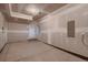 Spacious two car garage with freshly painted white walls at 6309 N Hanover St, Denver, CO 80238
