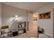 Home office with a modern desk, world map art, neutral walls and carpeted floor at 6309 N Hanover St, Denver, CO 80238
