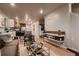 Spacious living room with an open layout, flowing into the kitchen and dining area, ideal for modern living at 6309 N Hanover St, Denver, CO 80238