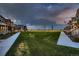 A vast, grassy park bordered by sidewalks and quaint homes, providing a scenic community gathering place at 6309 N Hanover St, Denver, CO 80238