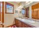 Bathroom with double vanity and tile flooring at 10730 Pinewalk Way, Highlands Ranch, CO 80130