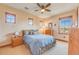 Bedroom with double bed and wood dresser at 10730 Pinewalk Way, Highlands Ranch, CO 80130