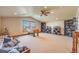 Spacious bonus room with foosball table and built-in shelving at 10730 Pinewalk Way, Highlands Ranch, CO 80130