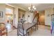 Dining area with hardwood floors and a view of the kitchen at 10730 Pinewalk Way, Highlands Ranch, CO 80130