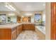 Large main bathroom with double vanity, soaking tub, and tile flooring at 10730 Pinewalk Way, Highlands Ranch, CO 80130