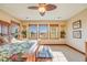 Bright main bedroom with large windows and tropical decor at 10730 Pinewalk Way, Highlands Ranch, CO 80130