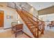 Upstairs hall with wooden staircase and small table and chairs at 10730 Pinewalk Way, Highlands Ranch, CO 80130