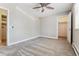 Spacious bedroom with neutral walls, plush carpeting, and a walk-in closet at 381 S Ames St # E104, Lakewood, CO 80226