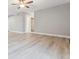 Expansive living room area featuring stylish hardwood floors, recessed lights and neutral paint colors at 381 S Ames St # E104, Lakewood, CO 80226