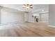 Spacious open floor plan living area with hardwood floors and neutral walls with an eat in kitchen at 381 S Ames St # E104, Lakewood, CO 80226