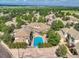 Aerial view of a neighborhood featuring a community pool, manicured landscaping, and well-maintained homes at 14064 E Whitaker Dr, Aurora, CO 80015