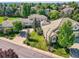 Gorgeous aerial view of luxury homes nestled in lush landscaping and mature trees at 14064 E Whitaker Dr, Aurora, CO 80015