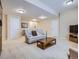 Finished basement featuring a comfortable seating area, modern entertainment center, and ample space for leisure at 14064 E Whitaker Dr, Aurora, CO 80015