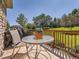 Outdoor deck area, complete with dining set, BBQ, and overlooking a beautiful, well-maintained lawn at 14064 E Whitaker Dr, Aurora, CO 80015