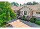 Beautiful stone and stucco home with a well-manicured yard and tile roof at 14064 E Whitaker Dr, Aurora, CO 80015