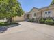 Charming single Gathering home with lush landscaping, a wide driveway and an attached garage at 14064 E Whitaker Dr, Aurora, CO 80015