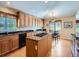 Bright kitchen boasting ample cabinetry, granite countertops, and modern stainless appliances at 14064 E Whitaker Dr, Aurora, CO 80015