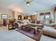 Open concept living room featuring lots of comfortable seating, and an open floor plan at 14064 E Whitaker Dr, Aurora, CO 80015