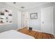 Cozy bedroom features hardwood floors, built-in shelves, and neutral paint at 1282 S Sherman St, Denver, CO 80210