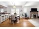 Charming dining area with hardwood floors and seamless access to the kitchen and fireplace at 1282 S Sherman St, Denver, CO 80210