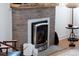 Close-up of a stylish fireplace with a decorative brick surround and modern insert at 1282 S Sherman St, Denver, CO 80210