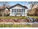 Charming brick home features a landscaped front yard and a welcoming walkway at 1282 S Sherman St, Denver, CO 80210