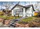 Charming brick home features a landscaped front yard and a welcoming walkway at 1282 S Sherman St, Denver, CO 80210