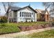 Charming brick home features a landscaped front yard and a welcoming walkway at 1282 S Sherman St, Denver, CO 80210
