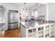 Well-lit kitchen with stainless steel countertops and hardwood floors at 1282 S Sherman St, Denver, CO 80210