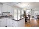 Open-concept kitchen view, featuring hardwood floors and a seamless flow to the living spaces at 1282 S Sherman St, Denver, CO 80210
