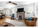 Cozy living room featuring a fireplace, hardwood floors, and comfortable seating at 1282 S Sherman St, Denver, CO 80210