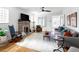 Spacious living room featuring a fireplace, hardwood floors, and comfortable seating at 1282 S Sherman St, Denver, CO 80210