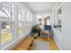Bright sun room with a bench and large windows offering natural light at 1282 S Sherman St, Denver, CO 80210