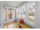 Bright sun room with a bench and large windows offering natural light at 1282 S Sherman St, Denver, CO 80210