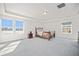 Spacious bedroom with large windows, tray ceiling, and light grey carpeting at 16278 E 111Th Pl, Commerce City, CO 80022