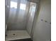 Modern bathroom with glass shower and tiled walls at 16278 E 111Th Pl, Commerce City, CO 80022