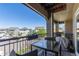 Outdoor balcony with seating area and neighborhood views, perfect for relaxing or entertaining at 11250 Florence St # 30B, Commerce City, CO 80640