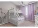 Charming bedroom featuring a bunk bed, soft carpet, and decorative accents at 11250 Florence St # 30B, Commerce City, CO 80640