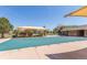 A community pool with a large green pool cover and shade canopies at 11250 Florence St # 30B, Commerce City, CO 80640