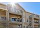 Inviting condo building with multiple levels, private balconies, and pleasant curb appeal at 11250 Florence St # 30B, Commerce City, CO 80640