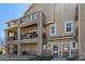 Beautiful condo exterior with stone accents, patios, and well-maintained landscaping at 11250 Florence St # 30B, Commerce City, CO 80640