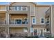 Charming condo building with multiple levels and balconies, plus well maintained landscaping with a brick facade at 11250 Florence St # 30B, Commerce City, CO 80640