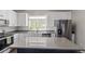 Updated kitchen features modern appliances, granite countertops, and plenty of cabinet space for all your cooking needs at 11250 Florence St # 30B, Commerce City, CO 80640