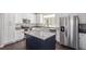 Modern kitchen featuring stainless steel appliances, sleek countertops, and a functional island with bar seating at 11250 Florence St # 30B, Commerce City, CO 80640