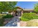 Entrance to the community pool area lined with lush green landscaping at 11250 Florence St # 30B, Commerce City, CO 80640