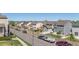 Neighborhood street view featuring well-maintained homes, parked cars, and scenic mountain views at 11250 Florence St # 30B, Commerce City, CO 80640