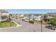 Street view of neighborhood homes with tidy lawns and parked vehicles under a sunny sky at 11250 Florence St # 30B, Commerce City, CO 80640