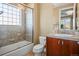 Well-lit bathroom featuring a shower-tub combo and vanity with sink at 26 Royal Ann Dr, Greenwood Village, CO 80111