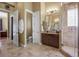 Bright bathroom featuring a walk-in shower, vanity with dual sinks, and toilet at 26 Royal Ann Dr, Greenwood Village, CO 80111